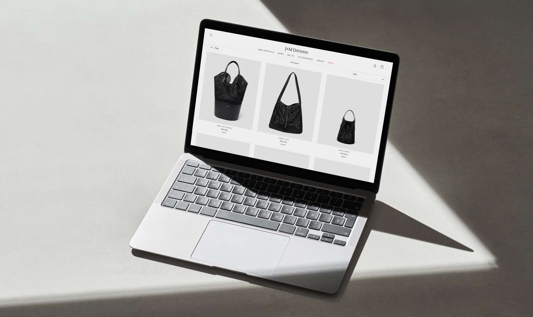 J and M Davidson website shown on a laptop by Revo