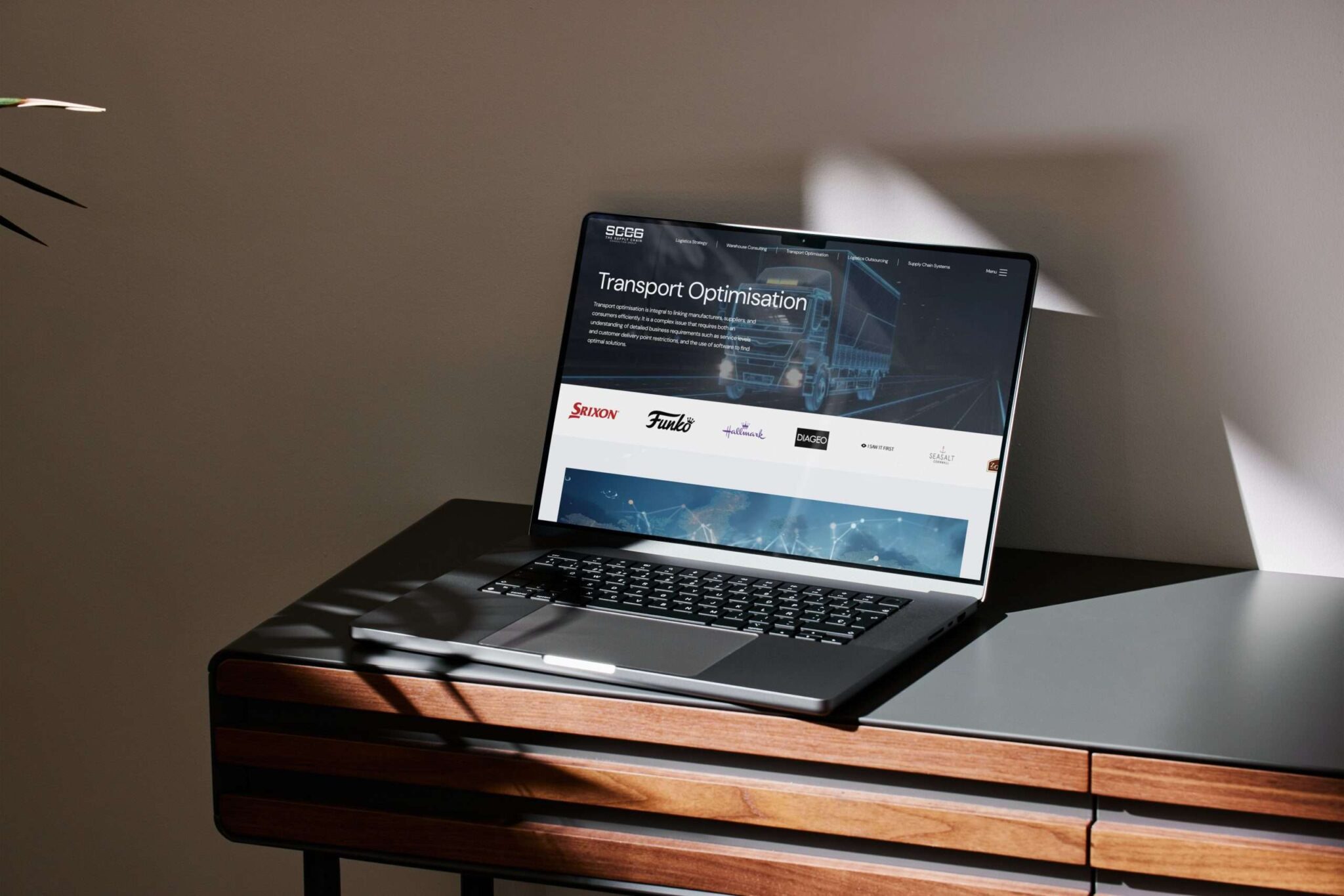 SCCG website shown on a laptop by Revo