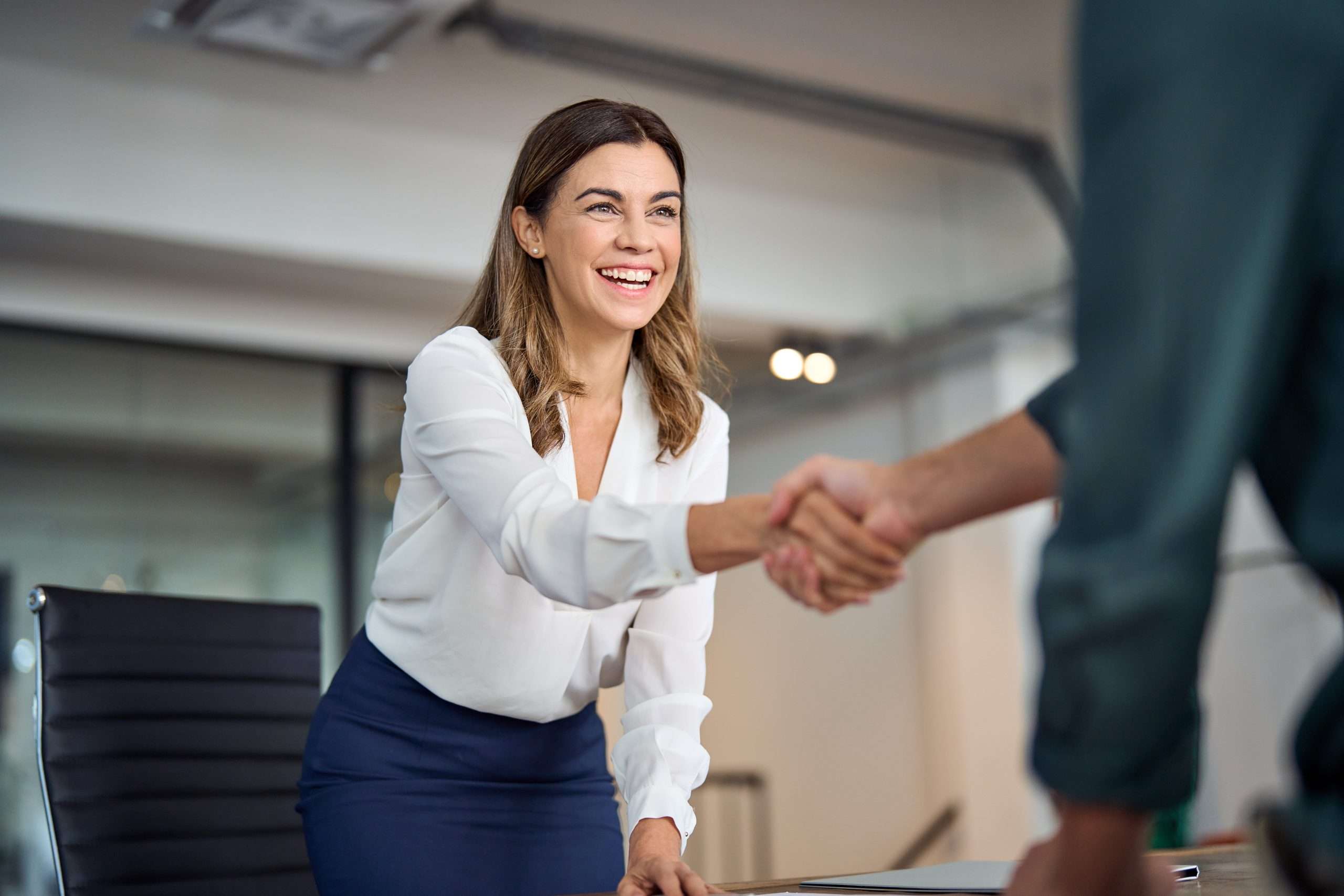 Manager welcoming a new client won through the company B2B lead generation website