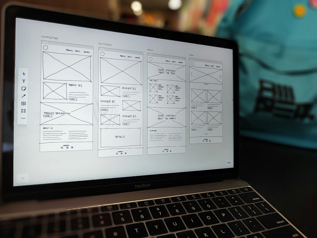 Laptop showing mobile app wireframe sketches